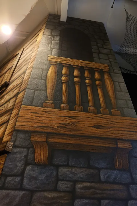 Tall medieval castle mural with stone arch, wood balcony railing and faux timber details